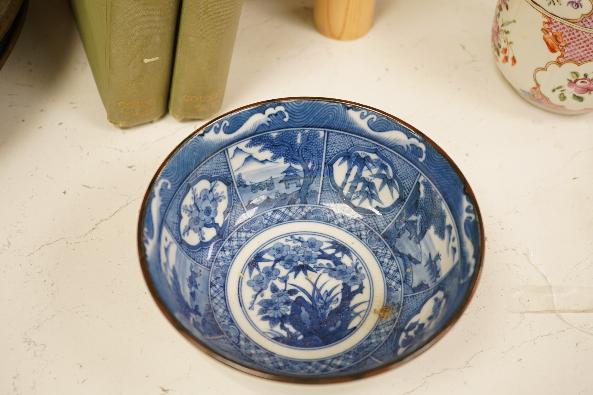 A group of Chinese blue and white porcelain, including a mid 19th century Canton enamel teabowl and a Japanese small dish, tallest 22cm. Condition - fair